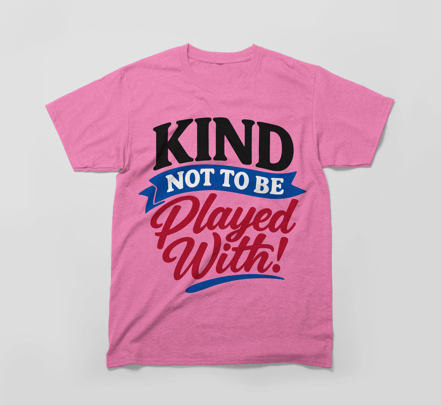 pink t-shirt with bold slogan 'kind not to be played with!' in black, blue, and red text