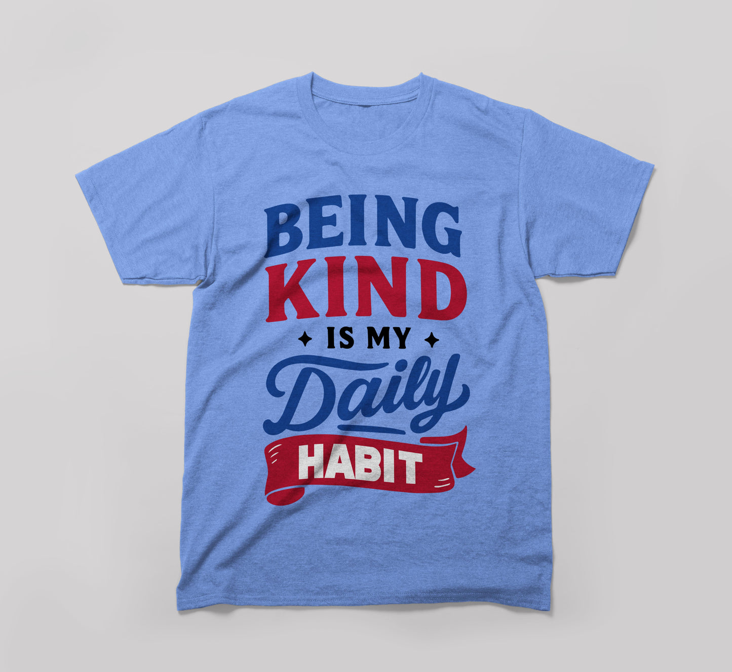 light blue t-shirt with 'being kind is my daily habit' motivational text graphic.