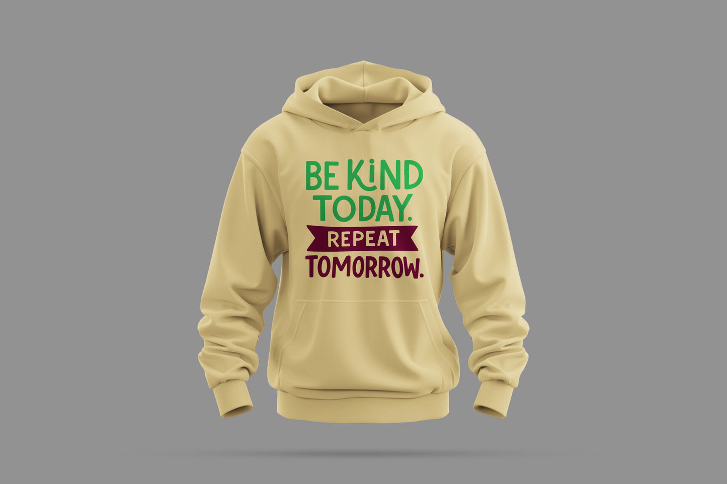 beige hoodie with 'be kind today. repeat tomorrow.' slogan in green and maroon text