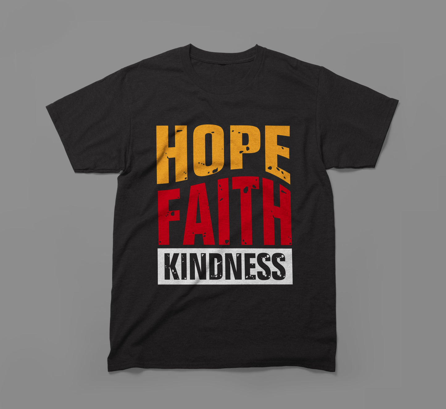 black t-shirt with hope faith kindness text in bold yellow, red, and white lettering.