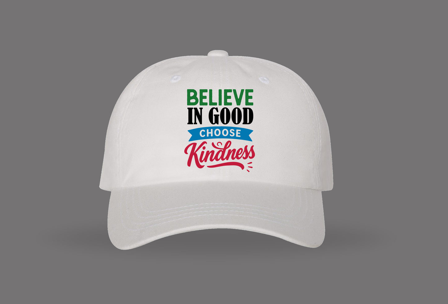 white baseball cap with 'believe in good choose kindness' in green, black, blue, and red text.