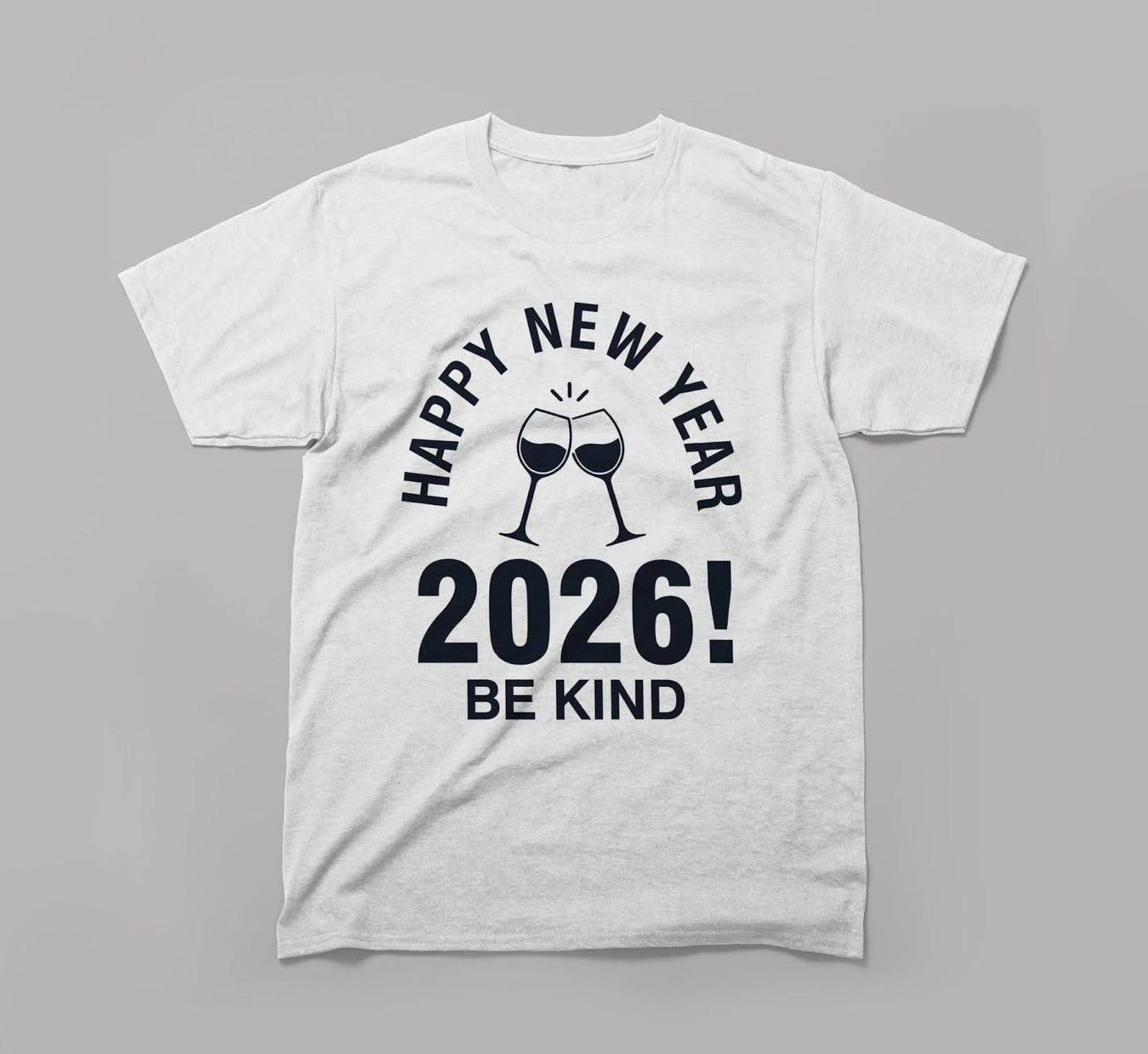 white t-shirt with 'happy new year 2026! be kind' and clinking glasses graphic