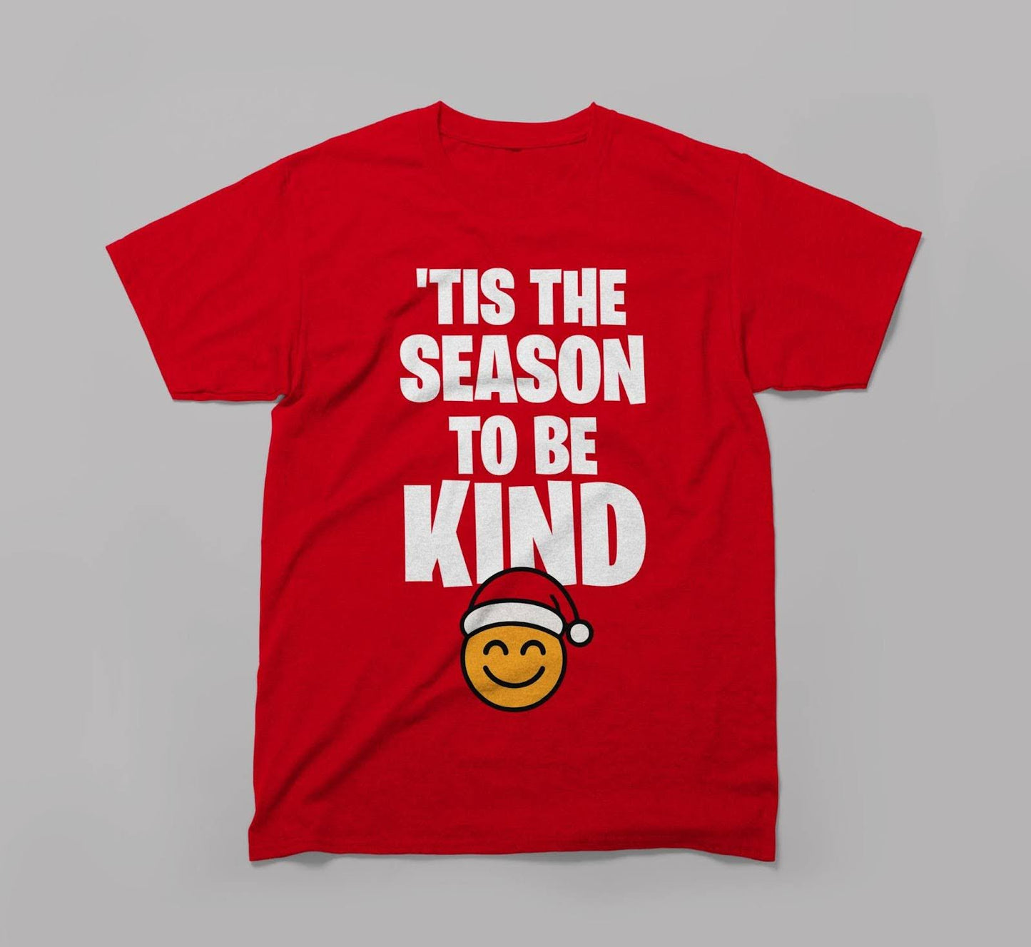 red holiday t-shirt with white 'tis the season to be kind' text and smiley santa emoji graphic