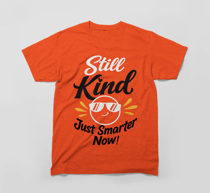 Orange t-shirt with 'Still Kind Just Smarter Now!' and smiling sun with sunglasses graphic.
