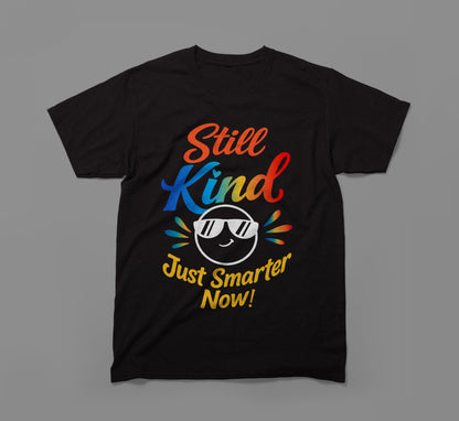 Black t-shirt with colorful 'Still Kind Just Smarter Now!' text and smiling emoticon graphic