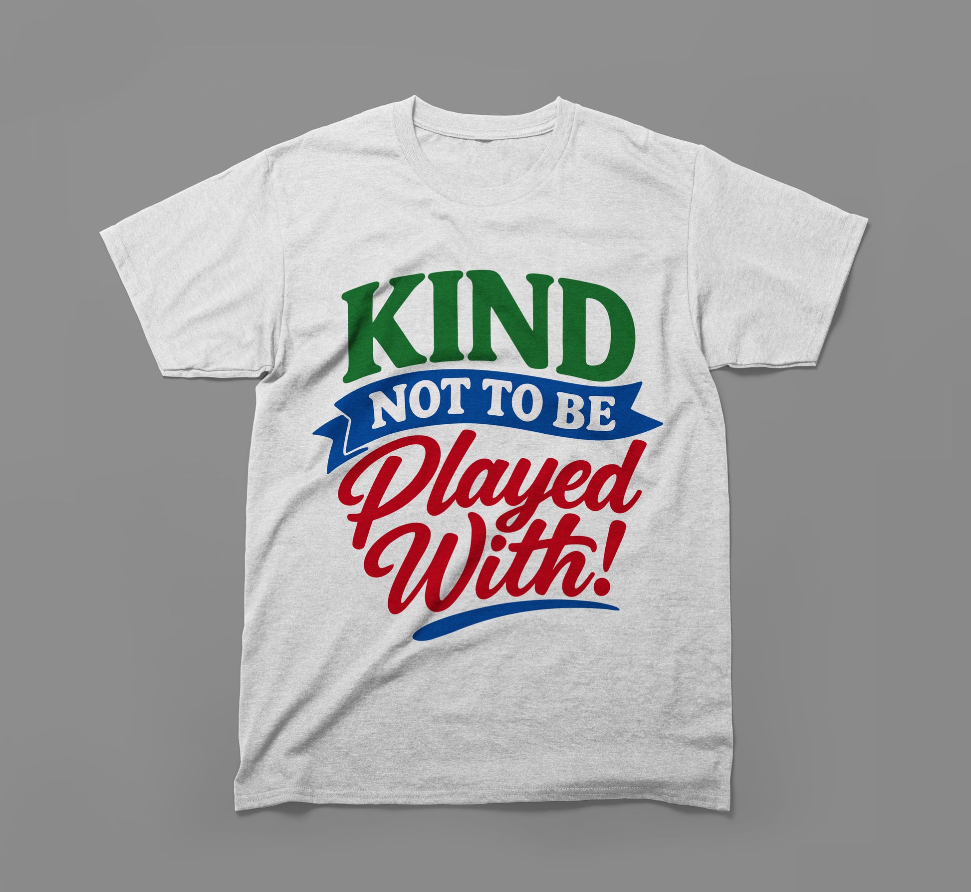 White t-shirt with colorful text saying 'Kind Not To Be Played With!' on gray background
