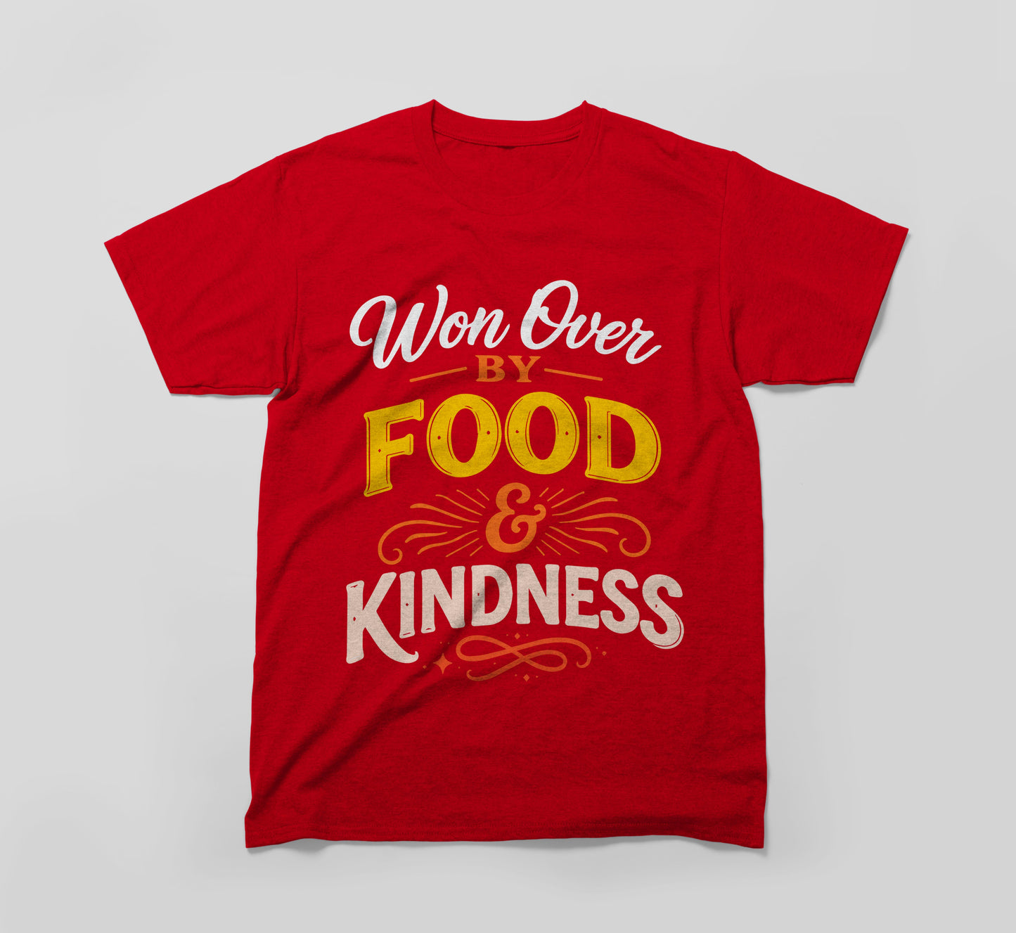 red t-shirt with the message 'won over by food & kindness' in bold, colorful text