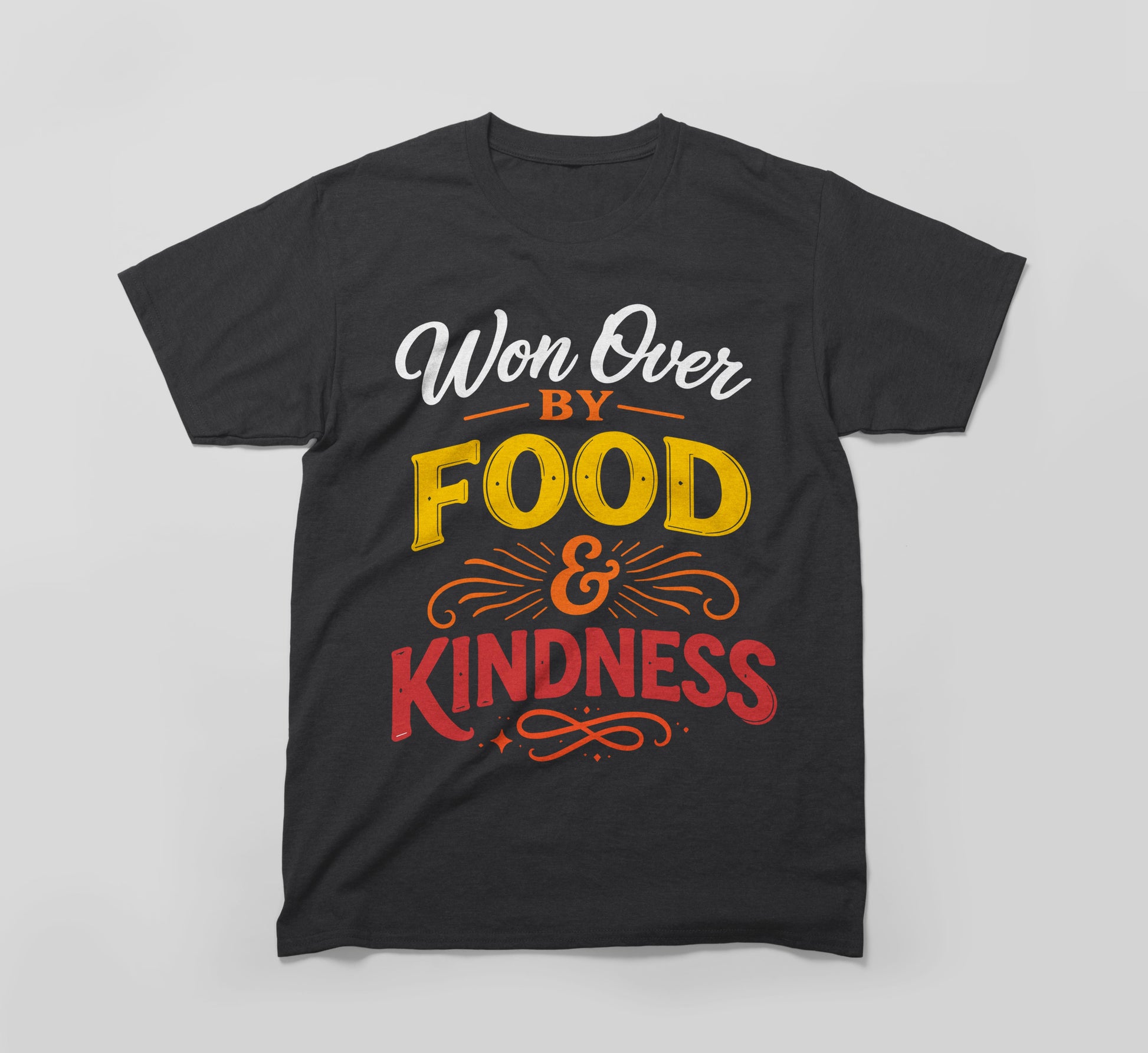 Black t-shirt with 'Won Over By Food & Kindness' colorful graphic text design