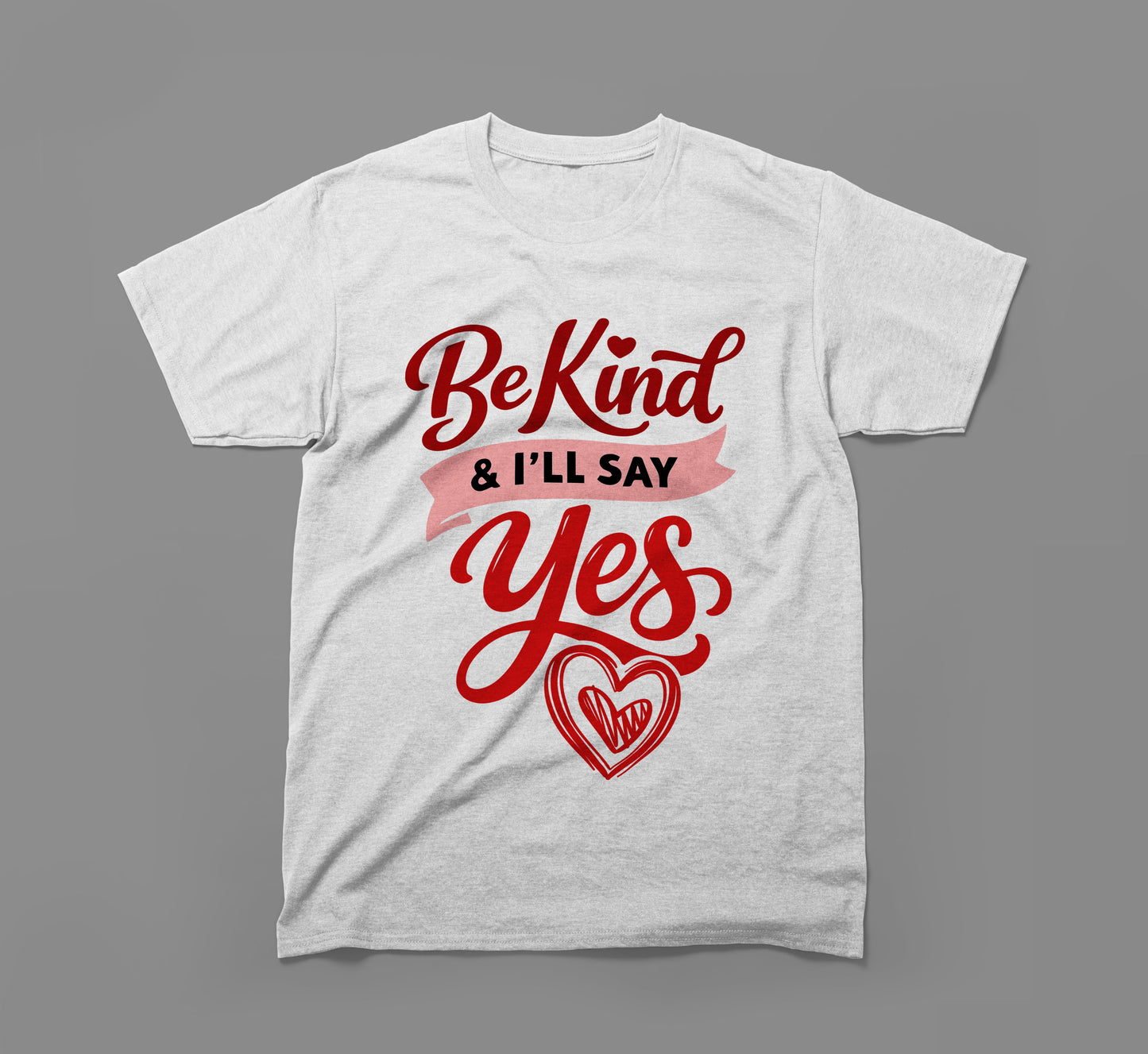 white t-shirt with red script saying be kind & i’ll say yes and a heart graphic.