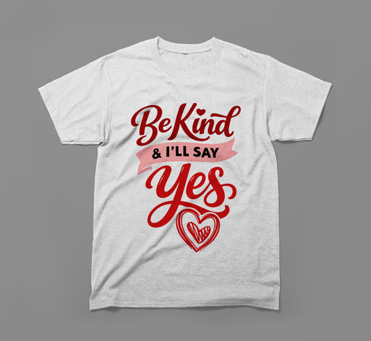 White t-shirt with red script saying Be Kind & I’ll Say Yes and a heart graphic.