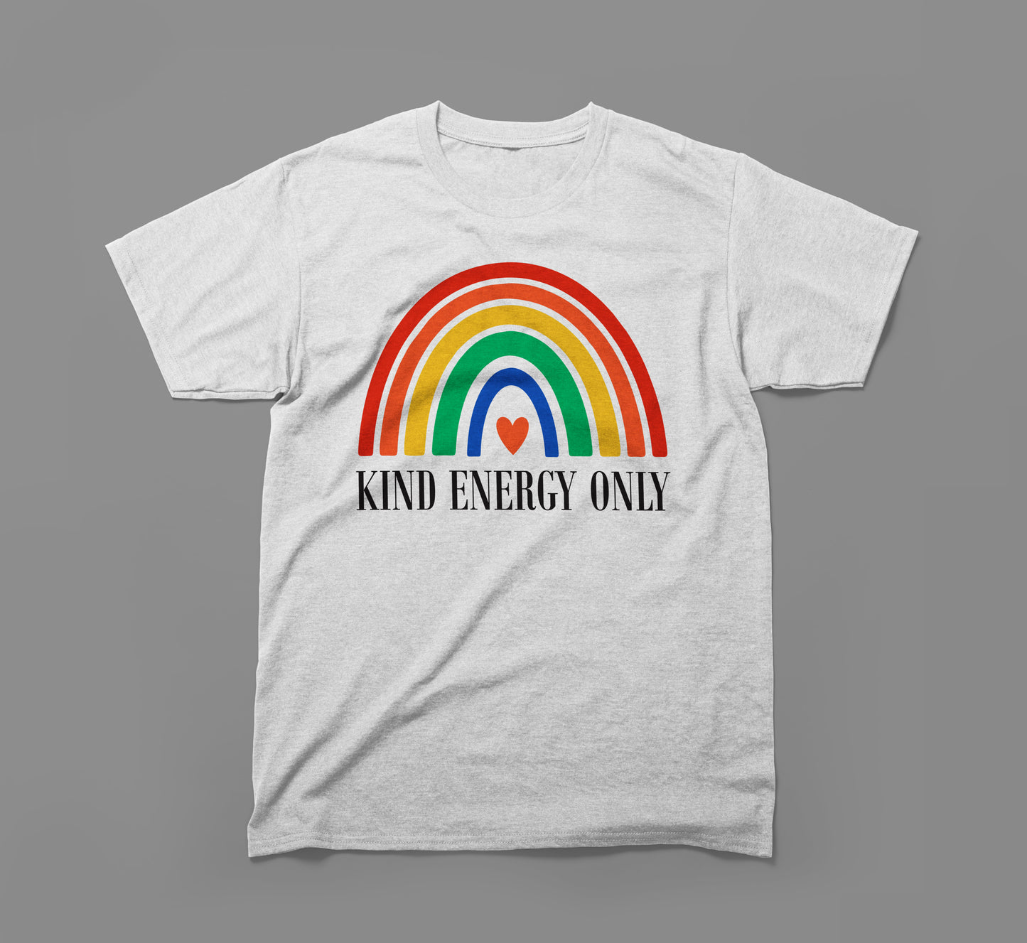 light grey t-shirt with rainbow graphic, heart, and 'kind energy only' text on front.