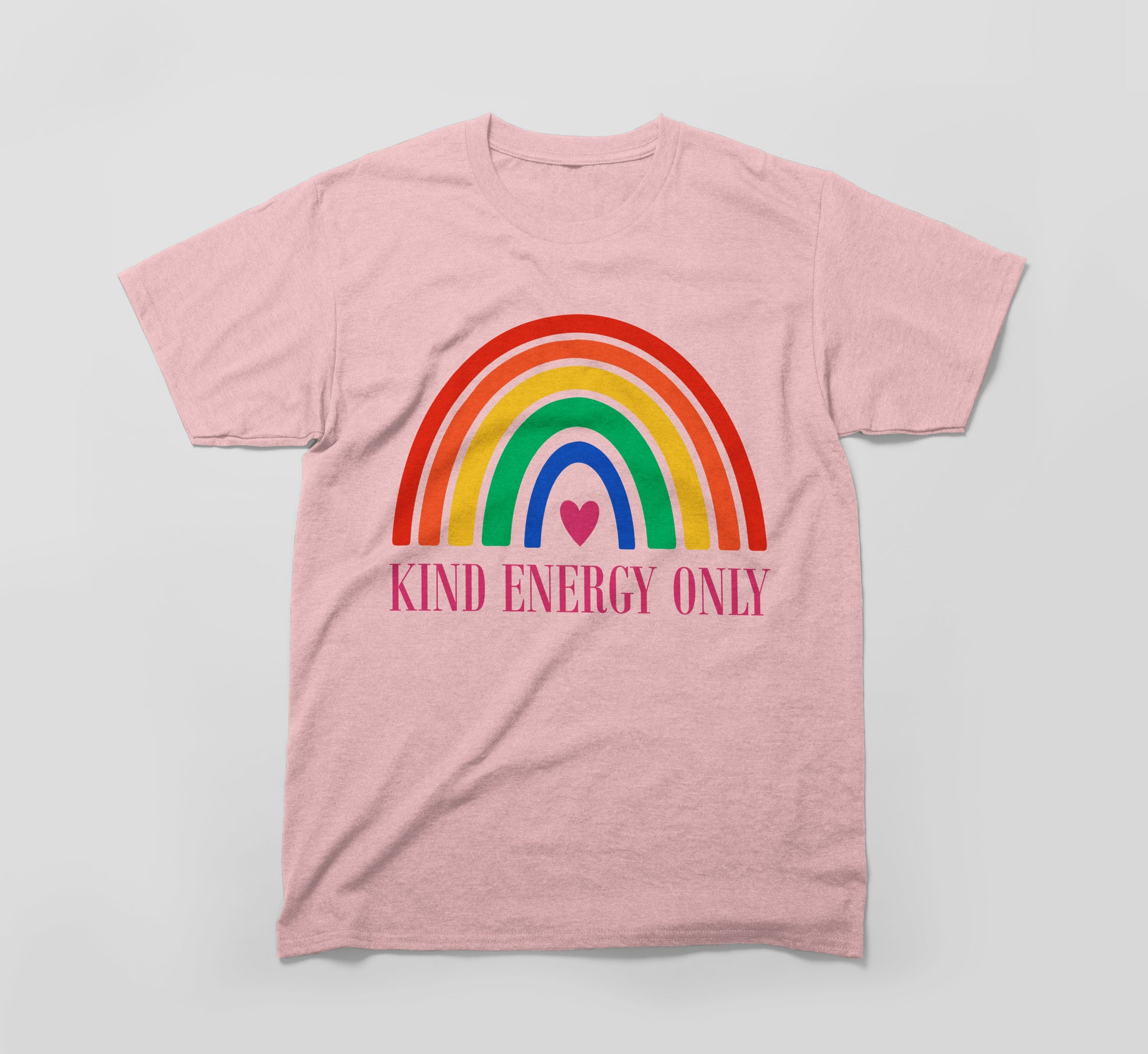 Pink t-shirt with colorful rainbow, heart, and 'Kind Energy Only' text promoting kindness.