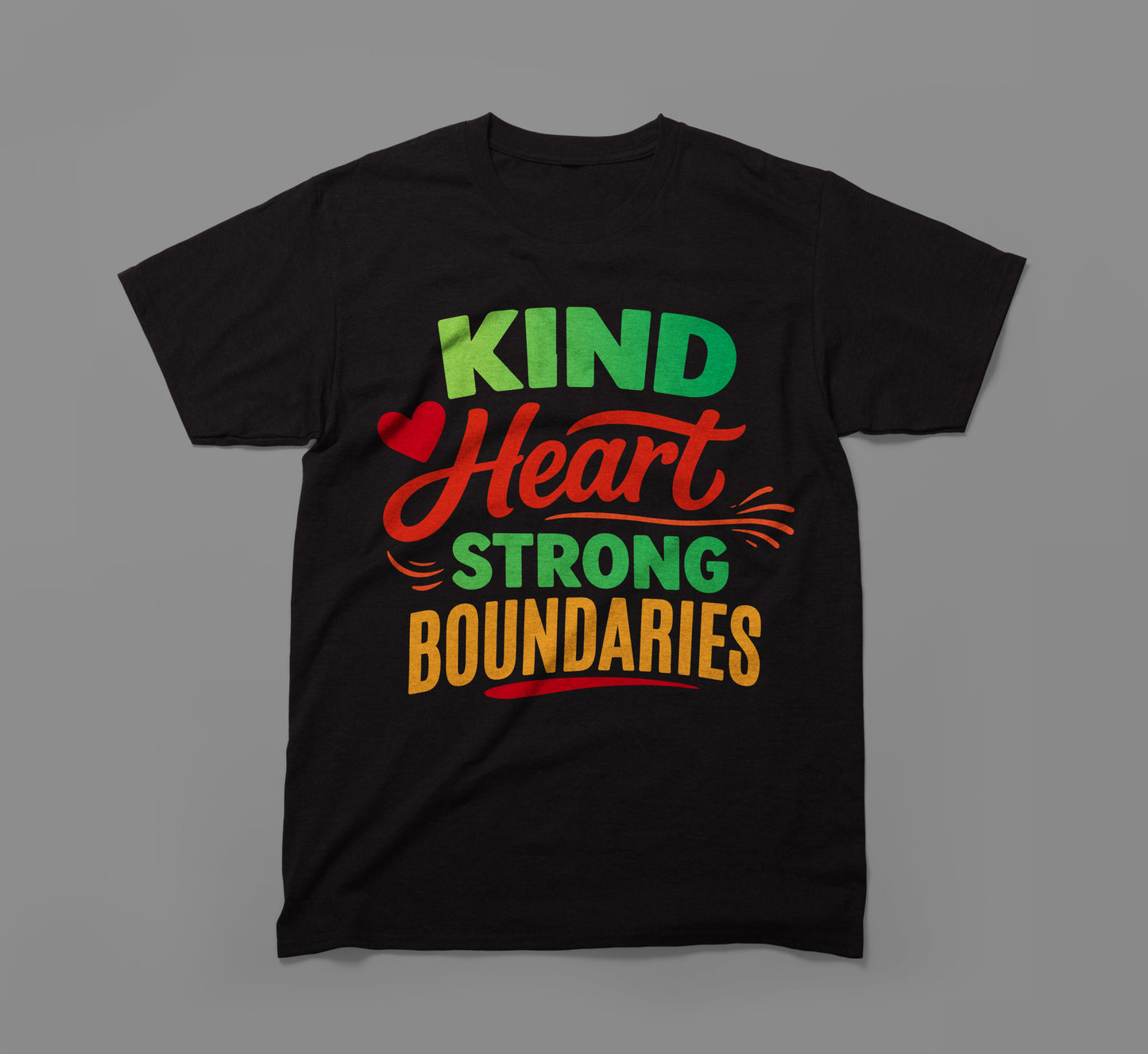 black t-shirt with colorful text saying 'kind heart strong boundaries' and a red heart graphic.