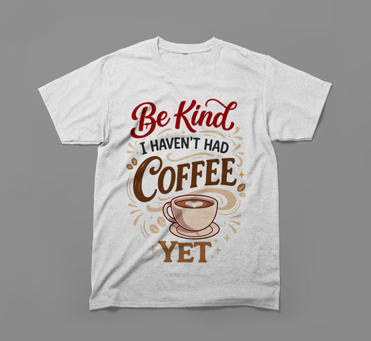 White t-shirt with 'Be Kind I Haven't Had Coffee Yet' and coffee cup graphic