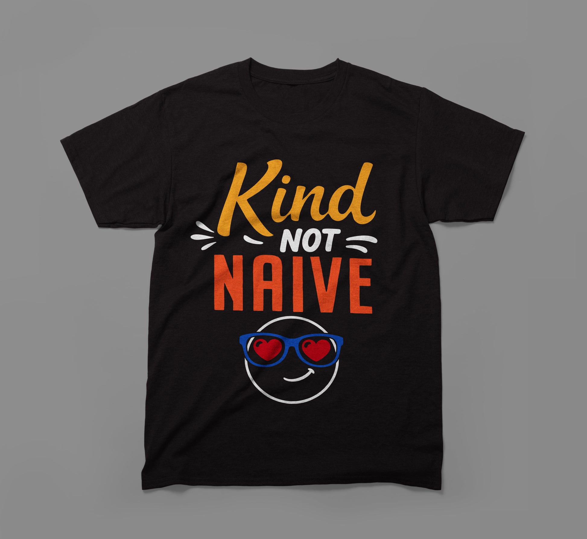 Black t-shirt with 'Kind Not Naive' slogan and smiley face wearing heart sunglasses.
