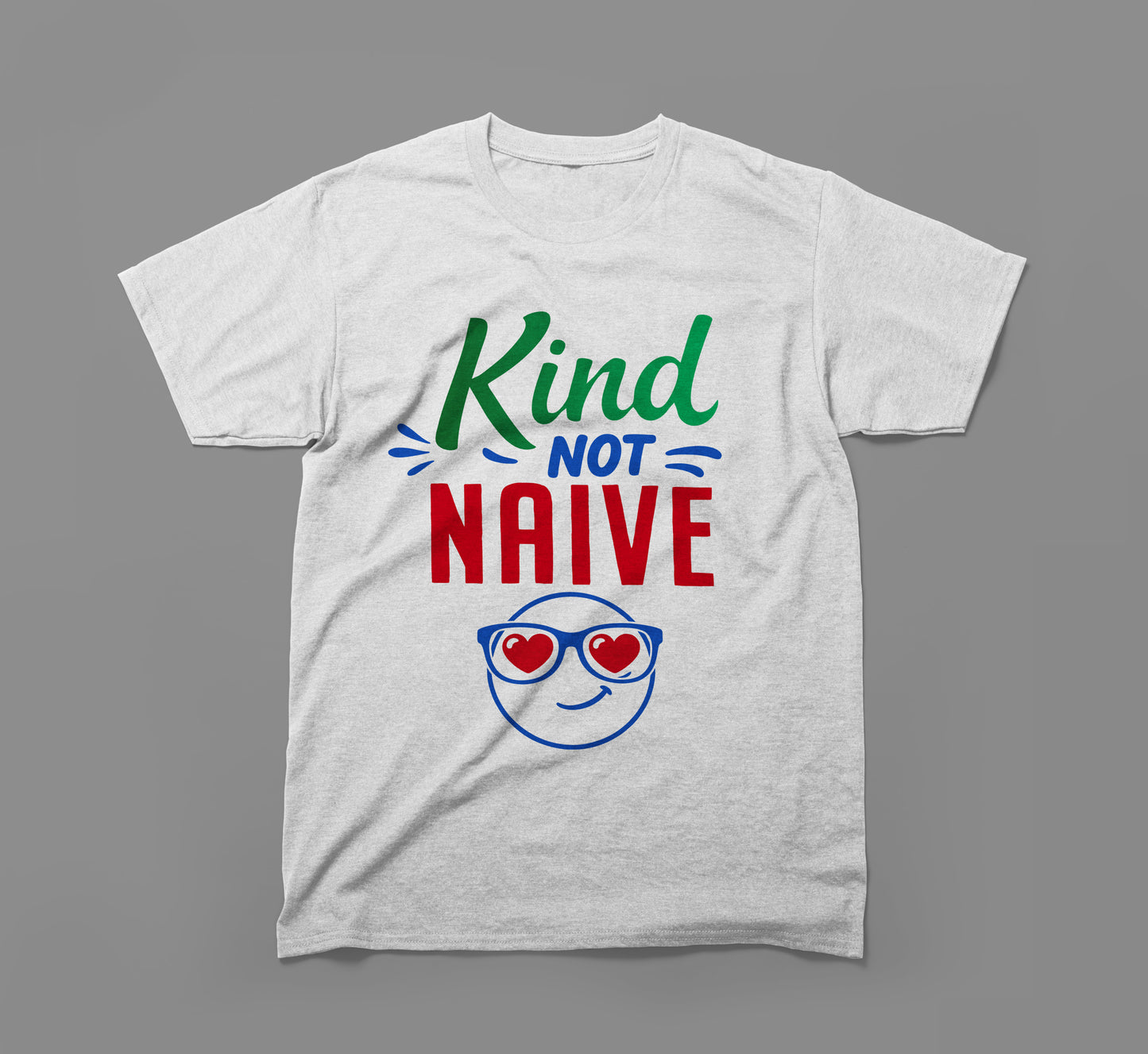 gray t-shirt with 'kind not naive' text and smiley face with heart sunglasses graphic.