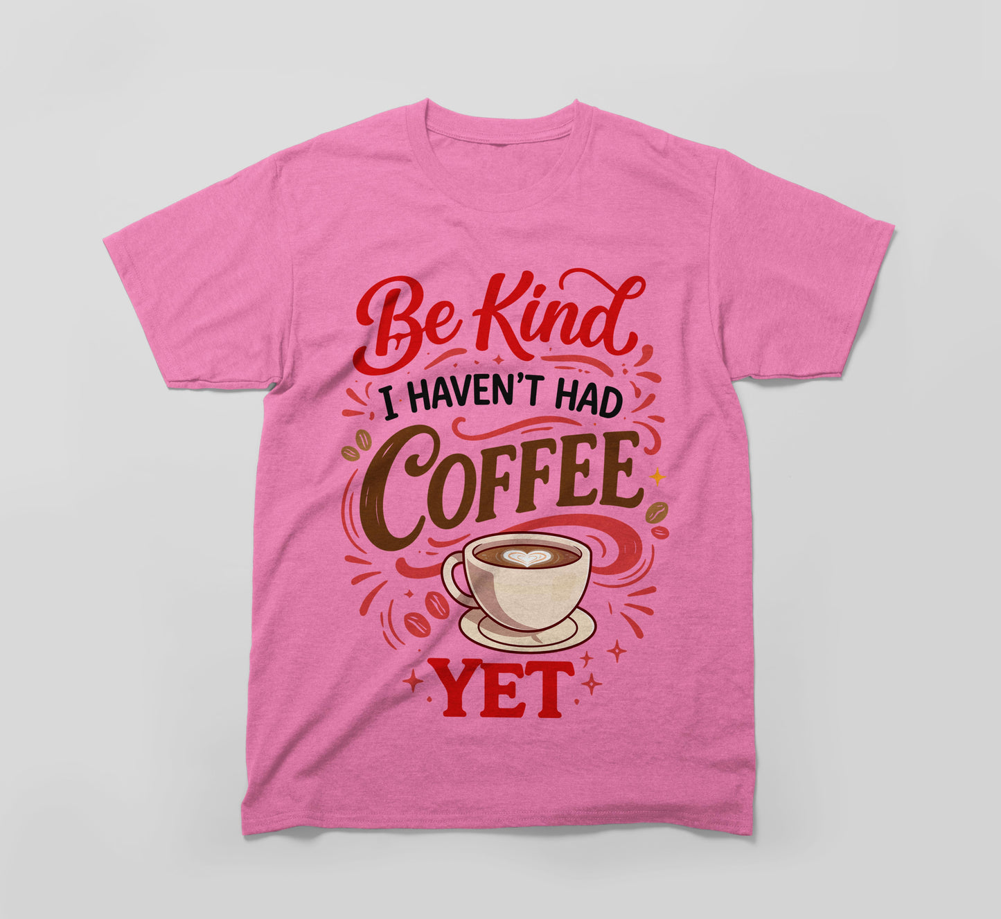 pink t-shirt with 'be kind i haven't had coffee yet' and a coffee cup graphic