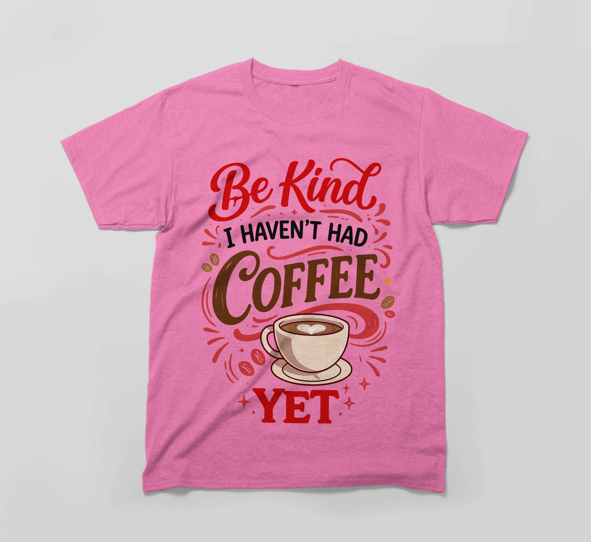 Pink t-shirt with 'Be Kind I Haven't Had Coffee Yet' and a coffee cup graphic