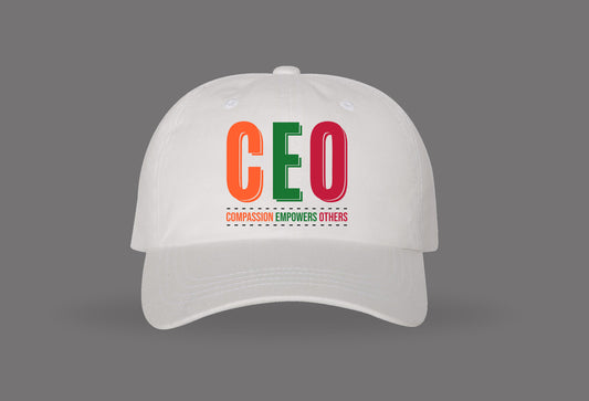 White baseball cap with colorful CEO text and 'Compassion Empowers Others' message
